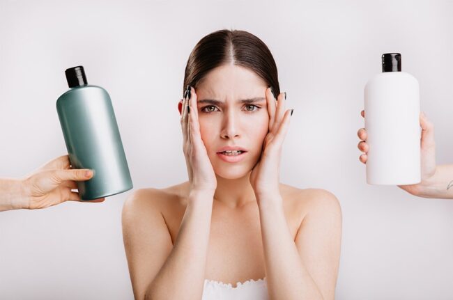 portrait-green-eyed-woman-without-makeup-isolated-wall-girl-decides-which-shampoo-is-better-use